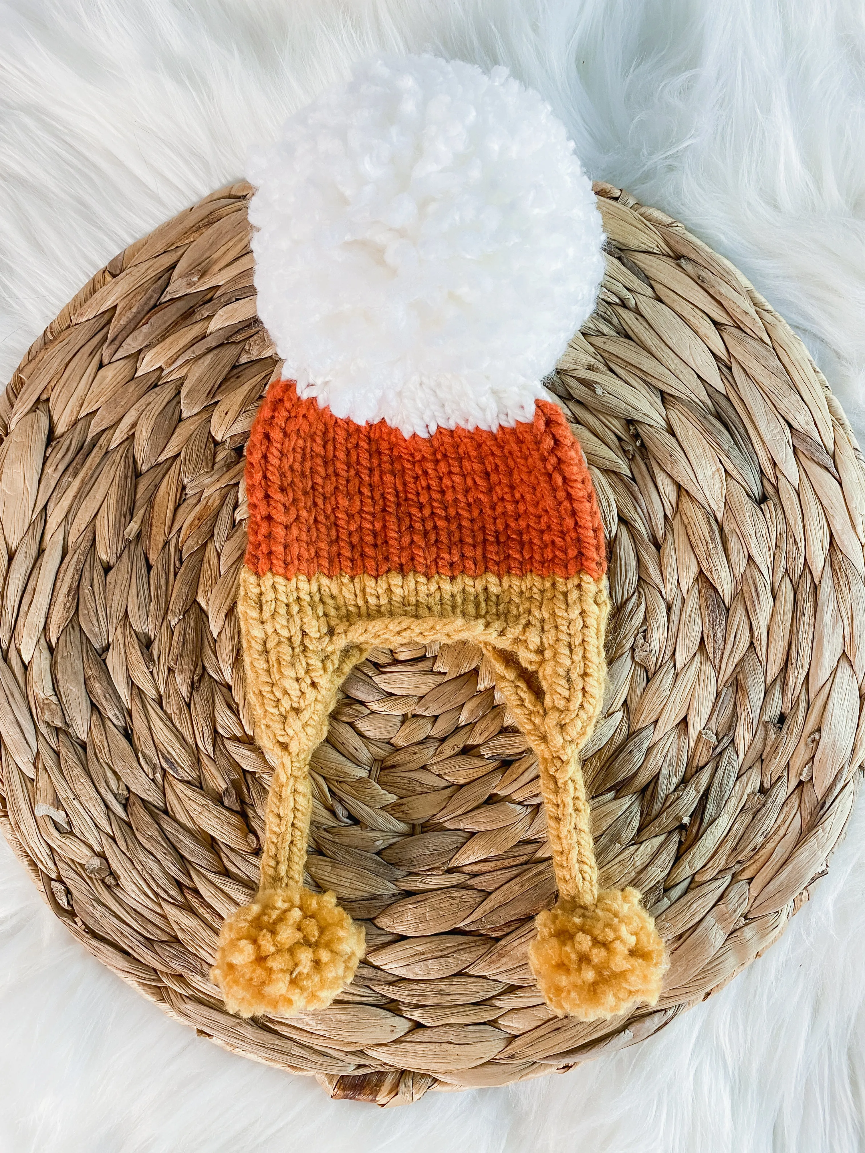 Hand-Knitted Candy Corn Baby Earflap Hat - Cozy Halloween Newborn Beanie with Pom Pom